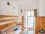Villa Malve Whg. 05 - Kinderzimmer mit Etagenbett und Zugang zum Balkon