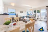 Villa Hügel B 04 - Whg. Möwe - großer Wohnbereich mit Zugang zum Balkon und offener Küche
