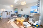 Villa Hügel B 04 - Whg. Möwe - großer Wohnbereich mit Zugang zum Balkon und offener Küche
