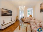 Villa Ute Whg. Vanessa - Wohnbereich mit Couch und TV