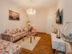 Villa Ute Whg. Vanessa - Wohnbereich  mit Couch und TV