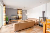 Ferienhaus Paula - Wohnzimmer mit Essbereich und Zugang zur Terrasse