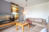 Ferienhaus Paula - Wohnzimmer mit Essbereich und Zugang zur Terrasse