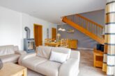 Ferienhaus Paula - Wohnzimmer mit Essbereich und Zugang zur Terrasse