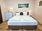 Villa Utpatel Whg. 02 - Wohnbereich mit Doppelbett und Loggia