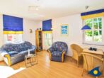Villa Margot Whg. 31 - Wohnzimmer mit Essbereich und Zugang zum Balkon 1