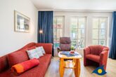 Villa Margot Whg. 07 - Wohn- / Essbereich mit offener Küche und Zugang zu Balkon
