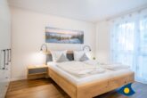 Bernsteinquartier Whg. 11 Inselglück - Schlafzimmer 1 mit Zugang zum Tageslichtbad