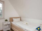 Fischerdorf Käptns Ferienhaus - Schlafzimmer mit Einzelbett