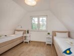 Fischerdorf Käptns Ferienhaus - Schlafzimmer mit Einzelbetten
