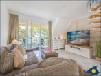 Dünenhaus Christa Whg. 14 - Wohnzimmer mit Esstisch und Zugang zum Balkon