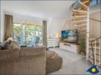 Dünenhaus Christa Whg. 14 - Wohnzimmer mit Esstisch und Zugang zum Balkon