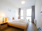 Haus Meeresrauschen Whg. 07 - Schlafzimmer mit begehbarem Kleiderschrank