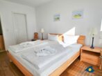 Haus Meeresrauschen Whg. 07 - Schlafzimmer mit Doppelbett und begehbarem Kleiderschrank