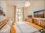 Ostseevilla Whg. 04 - Schlafzimmer 1 mit TV, Doppelbett und Balkon