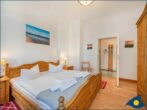Villa Perkunos Whg. 03 - Schlafzimmer mit Doppelbett