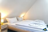 Kirchstraße Whg. 01 /- - Schlafbereich mit Zugang zum Balkon