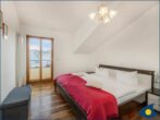 Villa auf der Düne Whg. 04 - separates Schlafzimmer mit Doppelbett und Balkon