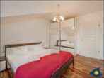 Villa auf der Düne Whg. 04 - separates Schlafzimmer mit Doppelbett und Balkon