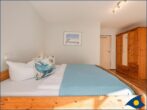 Apartmenthaus Baltic Five - Whg. 2 - Schlafzimmer mit Doppelbett und Zugang zur Terrasse