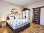 Villa Utpatel Whg. 01 - Wohnbereich mit Doppelbett und Loggia
