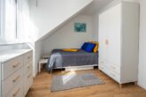Strandhus Ritzi - Schlafzimmer mit Doppelbett (140x200) und einem Einzelbett