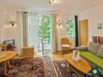 Villa Strandperle, Whg. 06 - Wohnzimmer mit Schlafcouch und Zugang zum Balkon