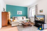 Seepark 25 Whg. 11 - Wohn- / Essbereich mit offener Küche und Zugang zu Balkon