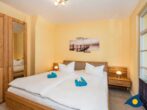 Villa Livia Whg. 13 - Schlafzimmer 1 mit Doppelbett und Zugang zum Balkon