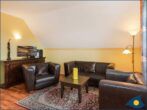 Ferienwohnung am Krebssee Whg Adler - Wohnbereich mit Couch und TV