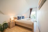 Ferienwohnung Hügelblick 07 - Schlafzimmer mit Doppelbett