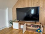 Ferienwohnung Hügelblick 07 - Wohnbereich mit offener Küche und Schlafcouch