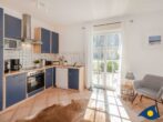 4-Sterne-Ferienhaus Anima mit Sauna, Kamin und Badeteich - Küche mit Terrassenblick