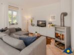 Ferienhaus Anima 4-Sterne mit Sauna und Kamin - Wohnbereich mit Couch, TV und Kamin