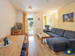 Villa Margot Whg. 23 ///- - Wohnzimmer mit Essbereich und Zugang zum Balkon