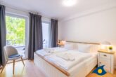 Villa Strandperle, Whg. 18 - Schlafzimmer mit Zugang zum Balkon