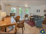 Villa Strandperle, Whg. 18 - Wohnbereich mit Couch und TV