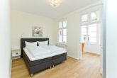 Villa Livia Whg. 01 /- - Schlafzimmer 2 mit Doppelbett und Erker